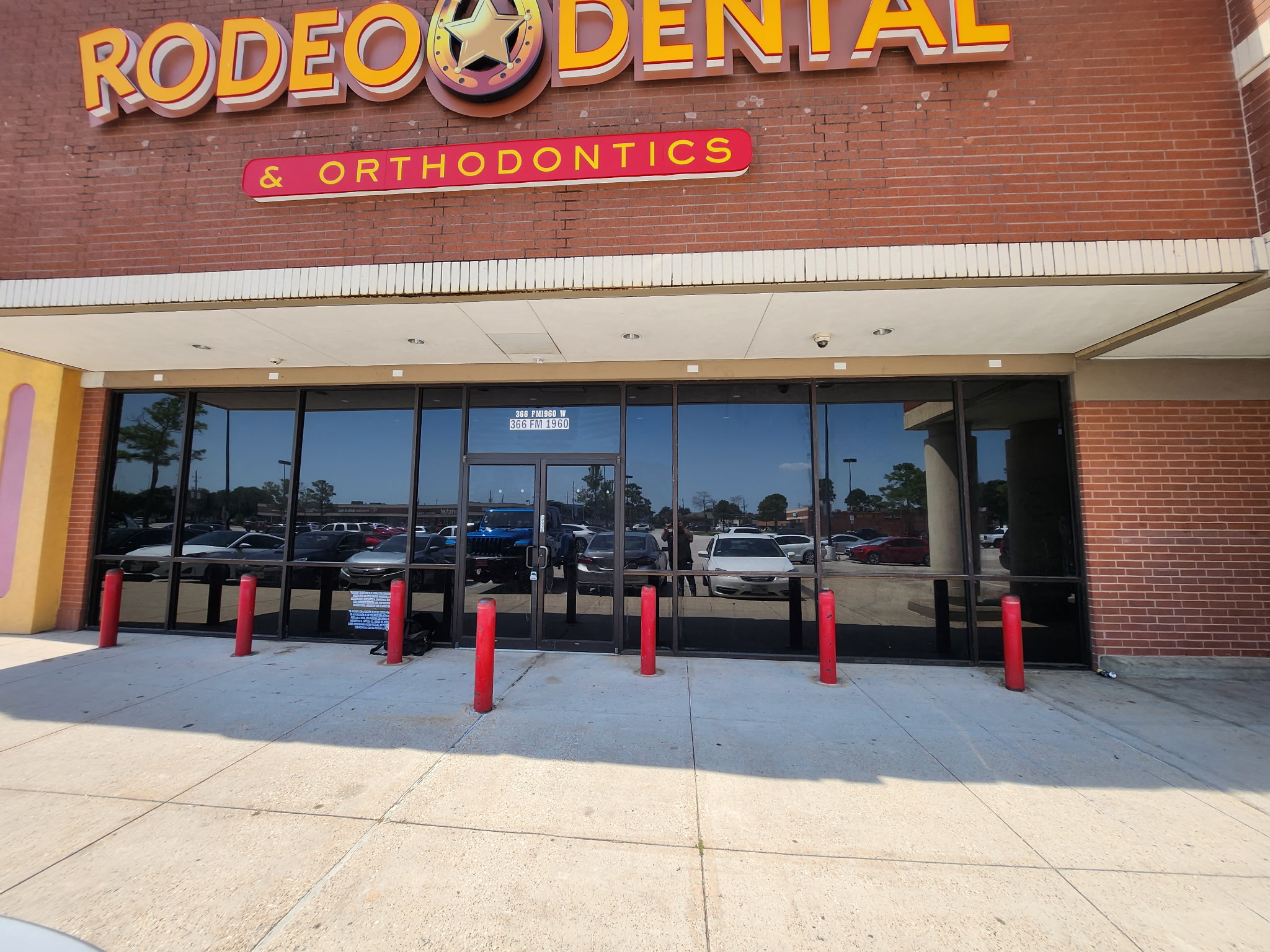 Osaka Sushi commercial storefront window tinting Houston — dark reflective film on restaurant entrance
