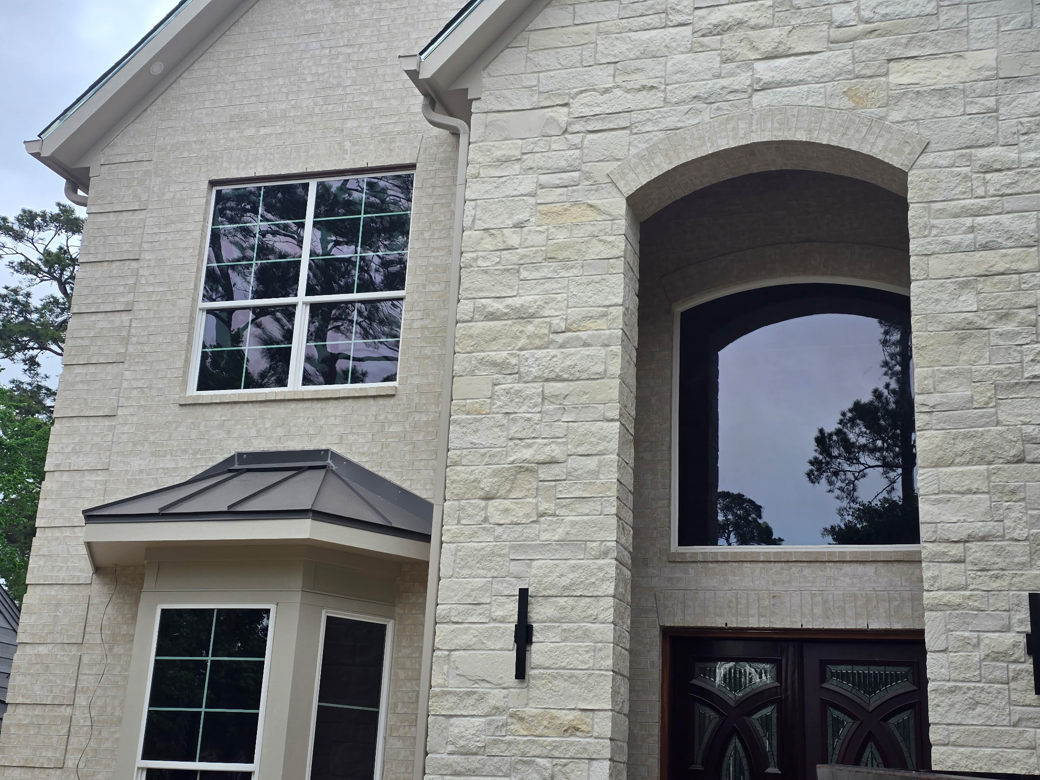 Rodeo Dental and Orthodontics Houston — dark commercial window tint on large storefront glass facade
